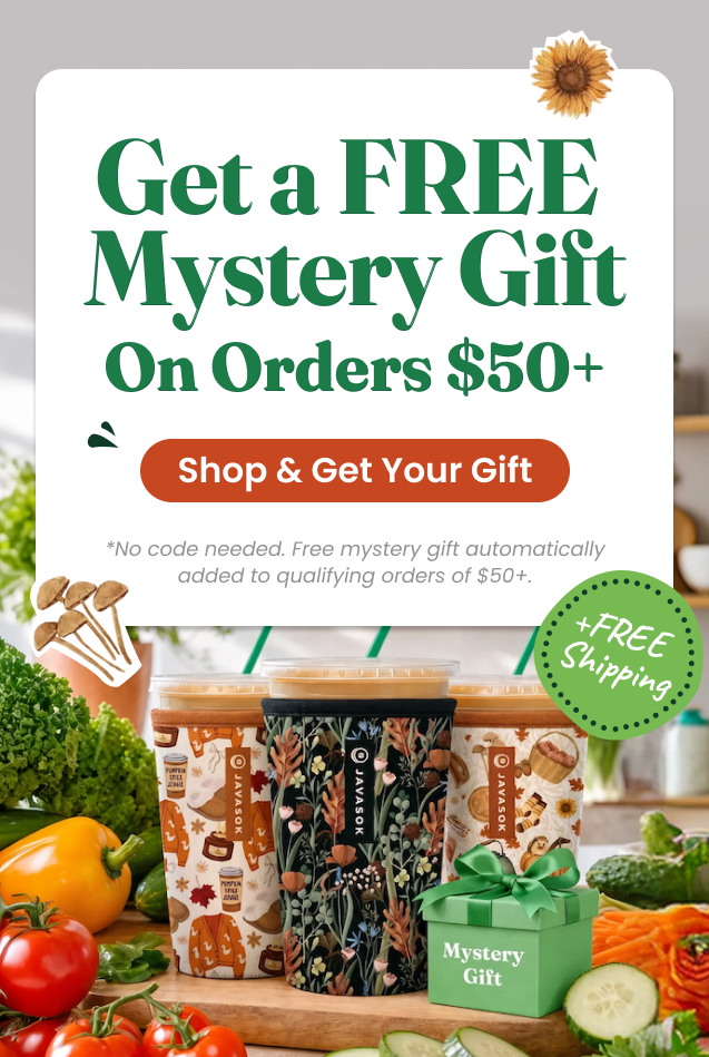 Promotional banner for a free mystery gift from orders $50+, featuring multiple illustrated takeaway cups and a small mystery gift box on a kitchen counter with tomatoes, cucumbers, and plants in the background.