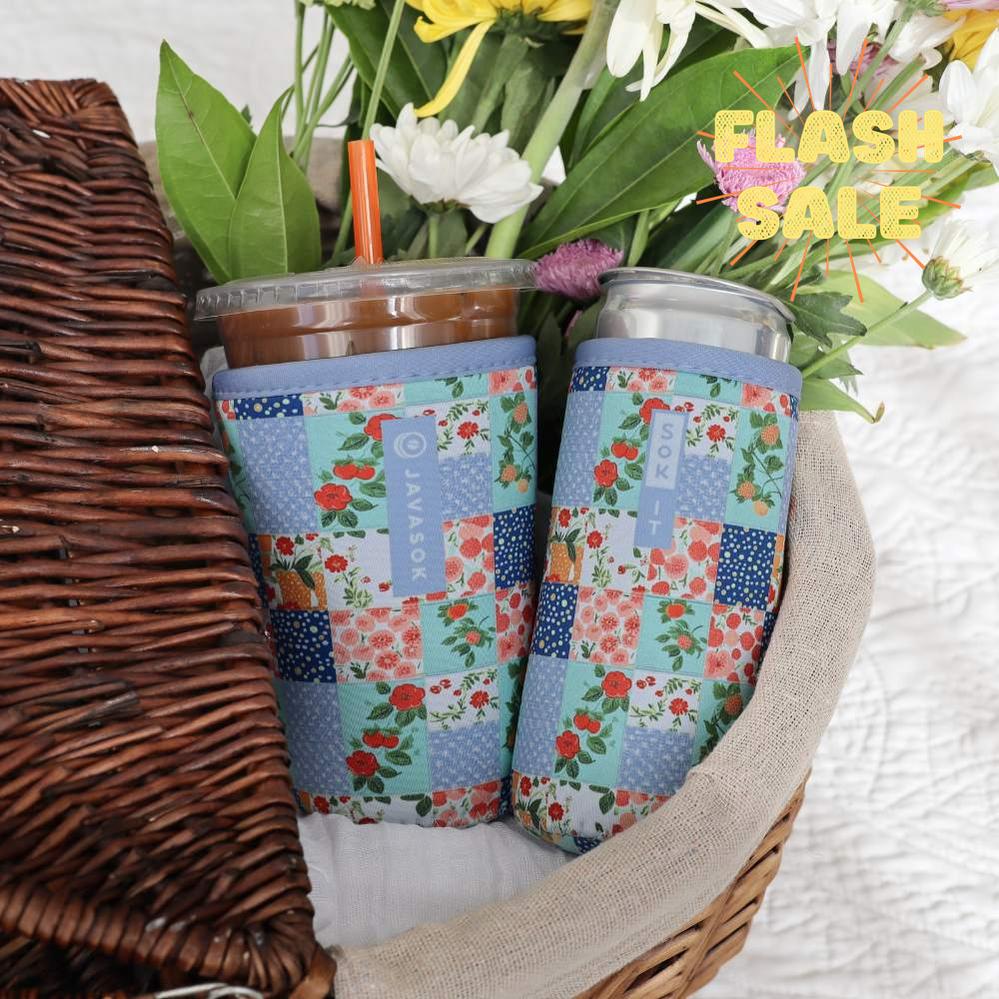 iced coffee and slim canned beverage in a basket with matching blue floral patchwork quilt neoprene drink sleeves